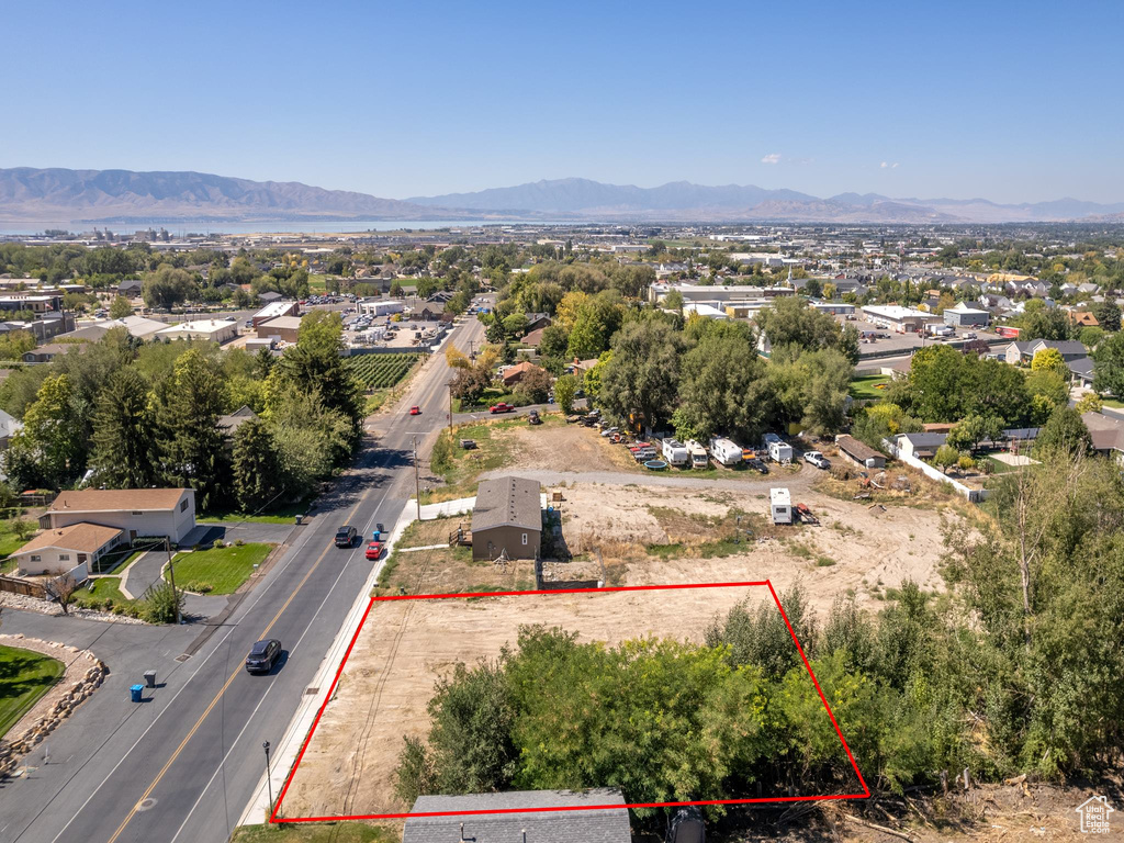 Birds eye view of property with a mountain view