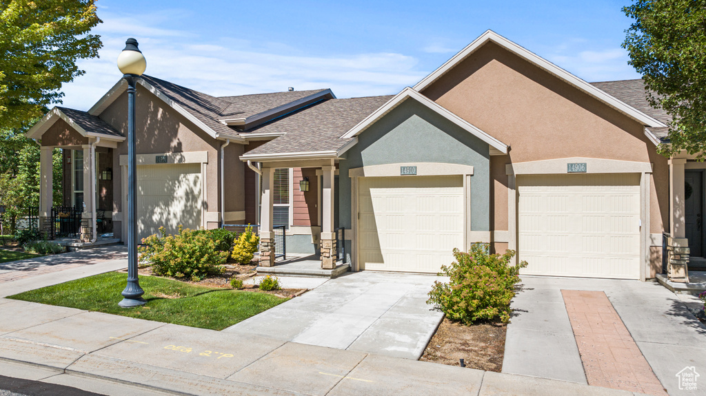 View of front facade featuring a garage