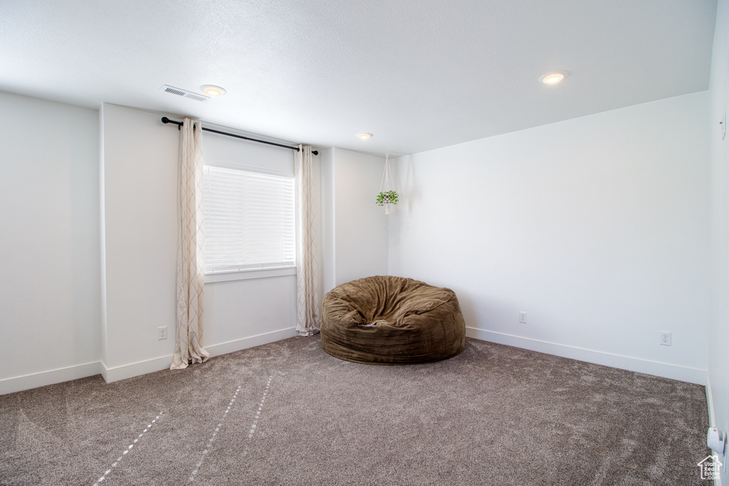 Unfurnished room featuring carpet