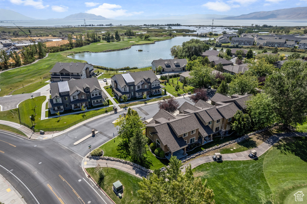 Birds eye view of property with a water and mountain view