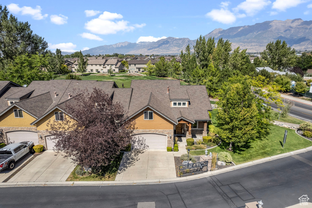 Exterior space with a mountain view and a garage