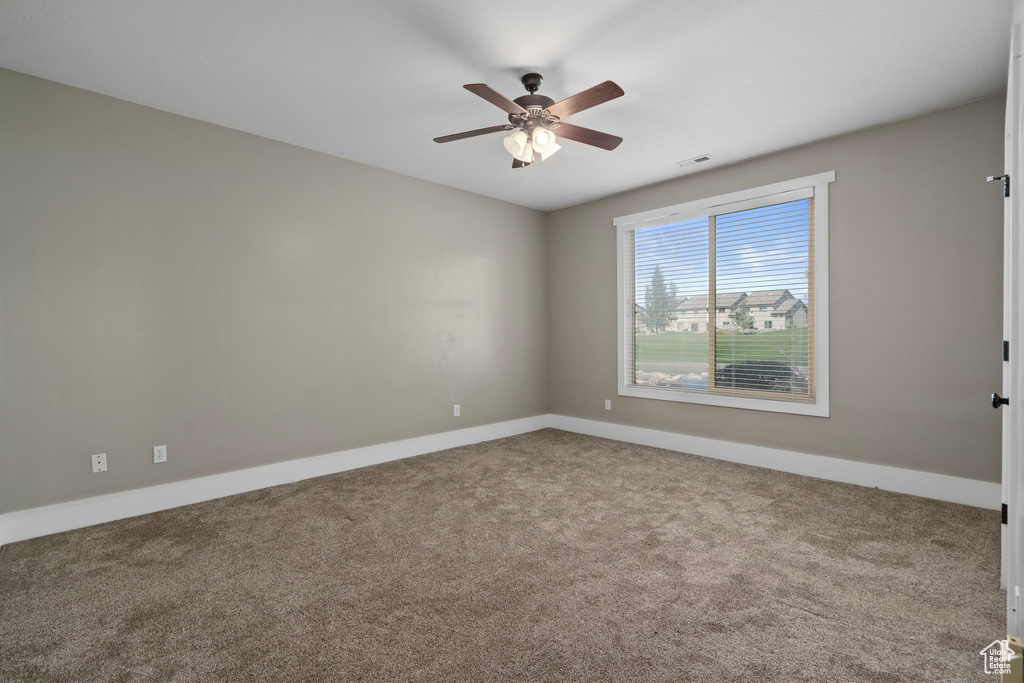 Unfurnished room with carpet flooring and ceiling fan