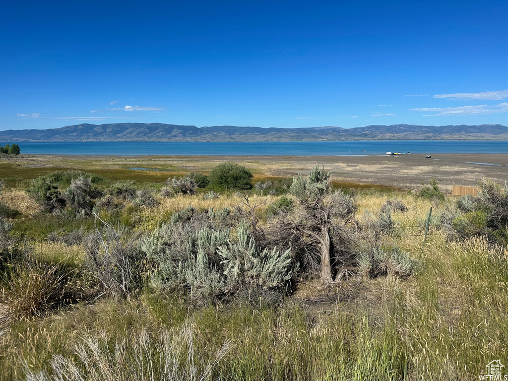 Property view of mountains with a water view