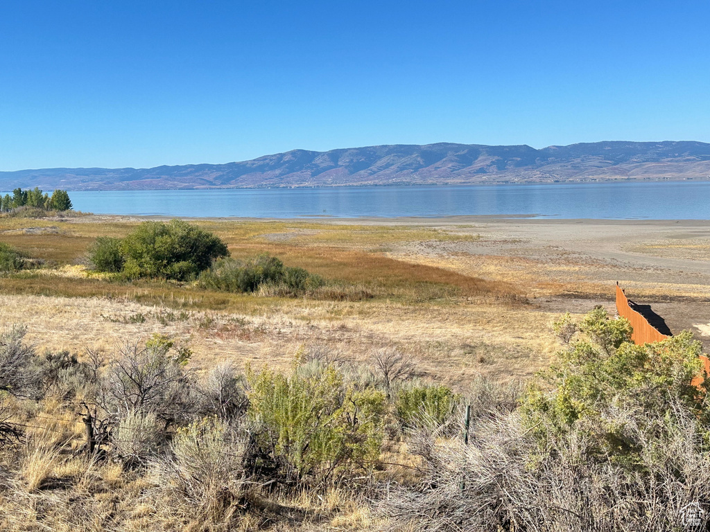 Mountain view featuring a water view