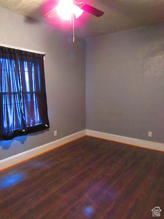 Spare room featuring ceiling fan and hardwood / wood-style floors