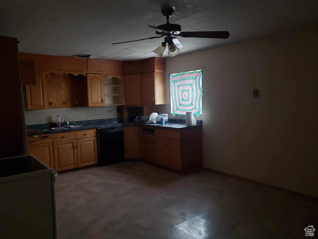 Kitchen featuring black dishwasher, ceiling fan, and range