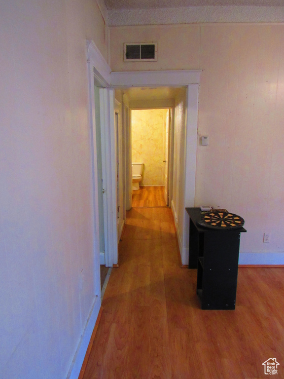 Corridor with wood-type flooring