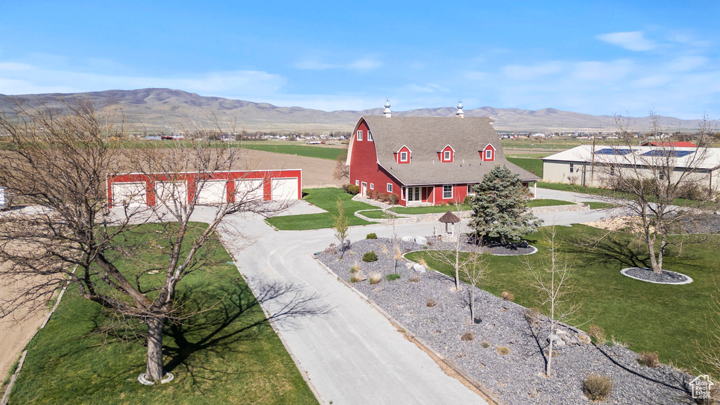 View from above of property with a mountain backdrop