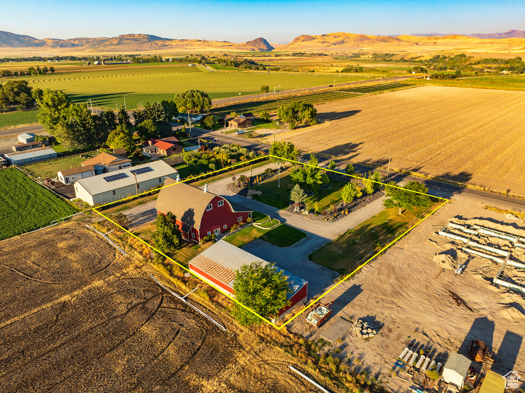 Birds eye view of property with a rural view and a mountain view