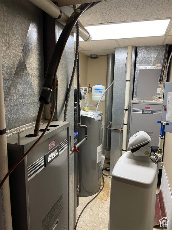 Utility room featuring water heater