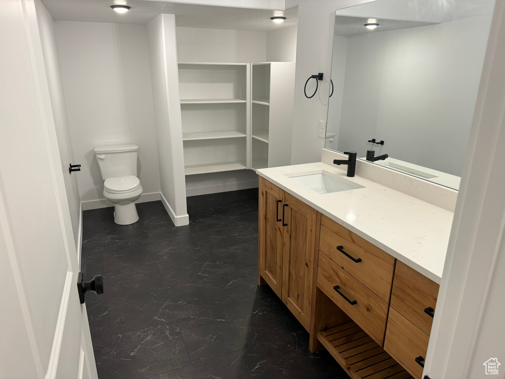 Bathroom featuring toilet and vanity