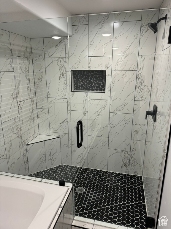 Bathroom featuring a shower with shower door