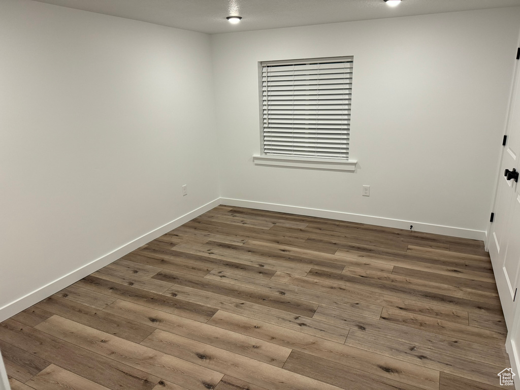 Unfurnished room featuring wood-type flooring