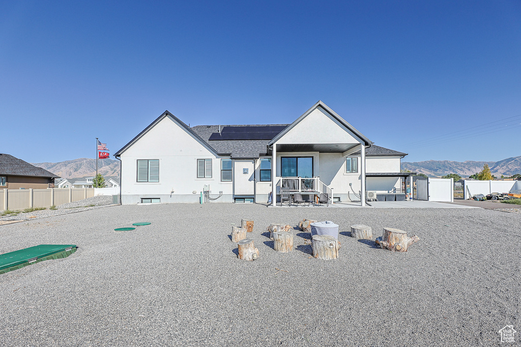 View of front of home featuring a mountain view