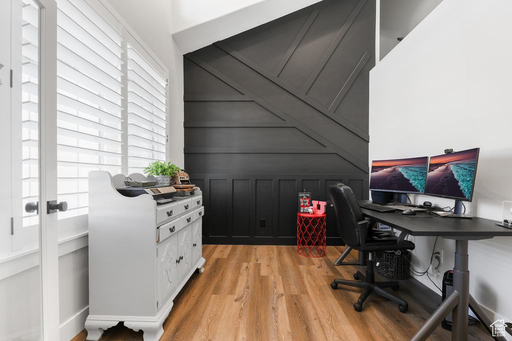 Office space featuring light hardwood / wood-style floors