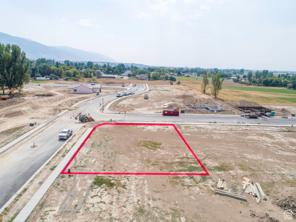 Birds eye view of property with a mountain view