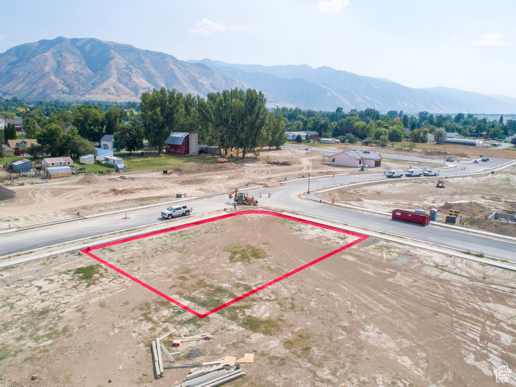 Birds eye view of property with a mountain view