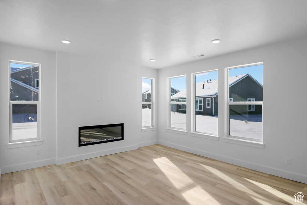 Unfurnished living room featuring light hardwood / wood-style floors