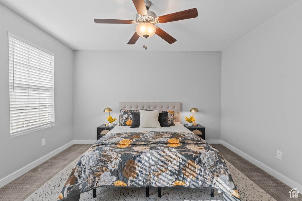 Bedroom featuring carpet and ceiling fan