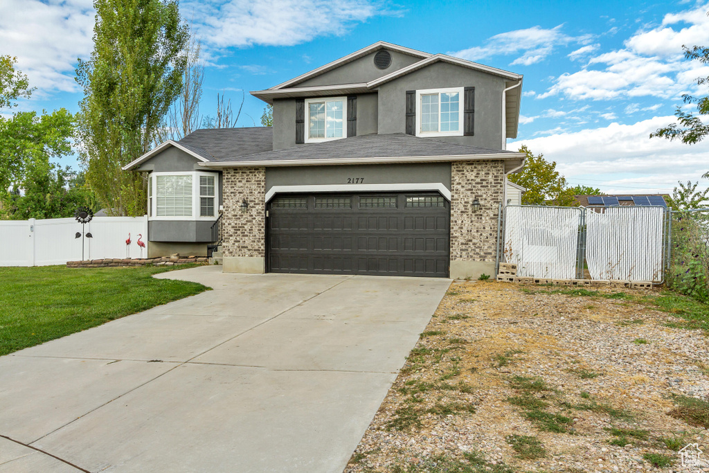 Front of property featuring a garage