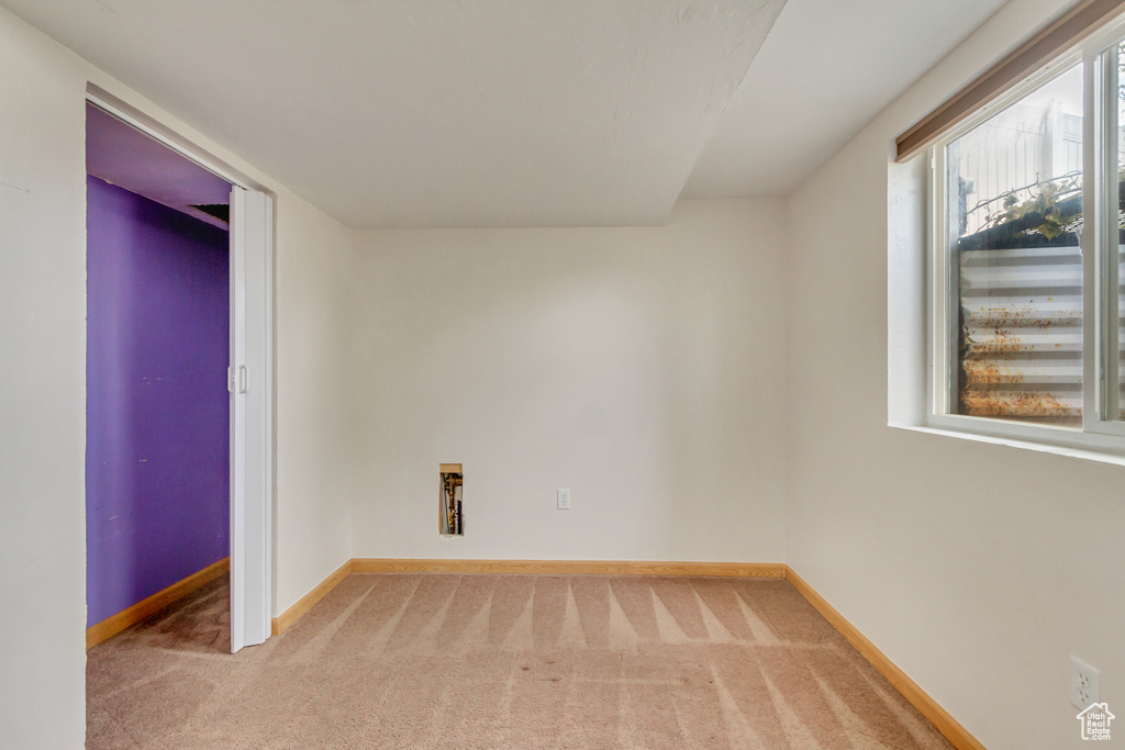 Carpeted empty room with plenty of natural light