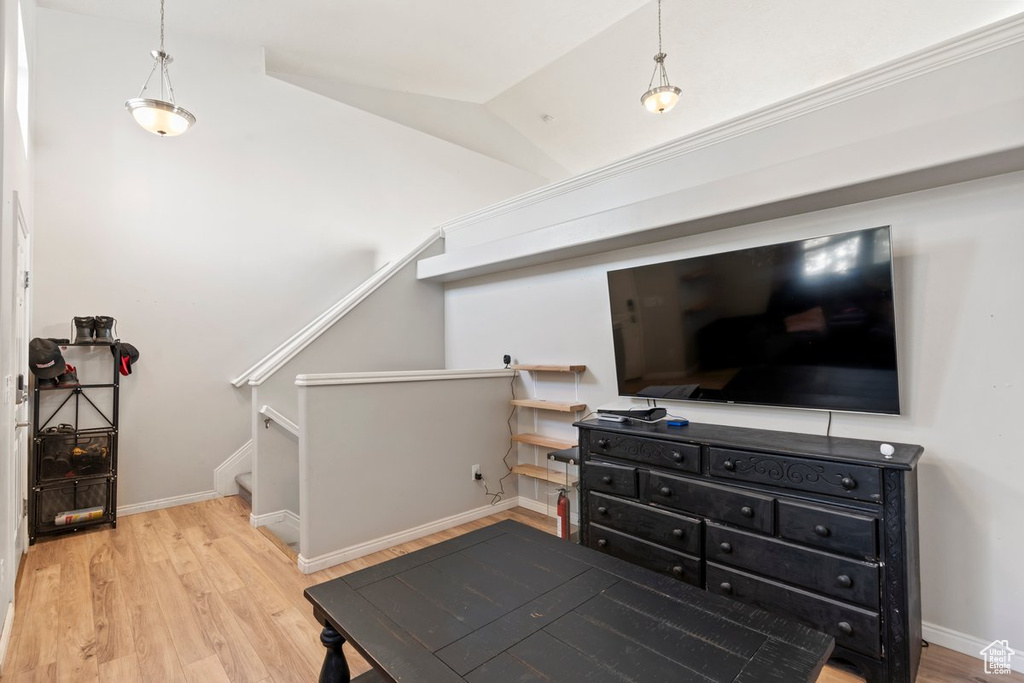 Interior space with light wood-type flooring and lofted ceiling