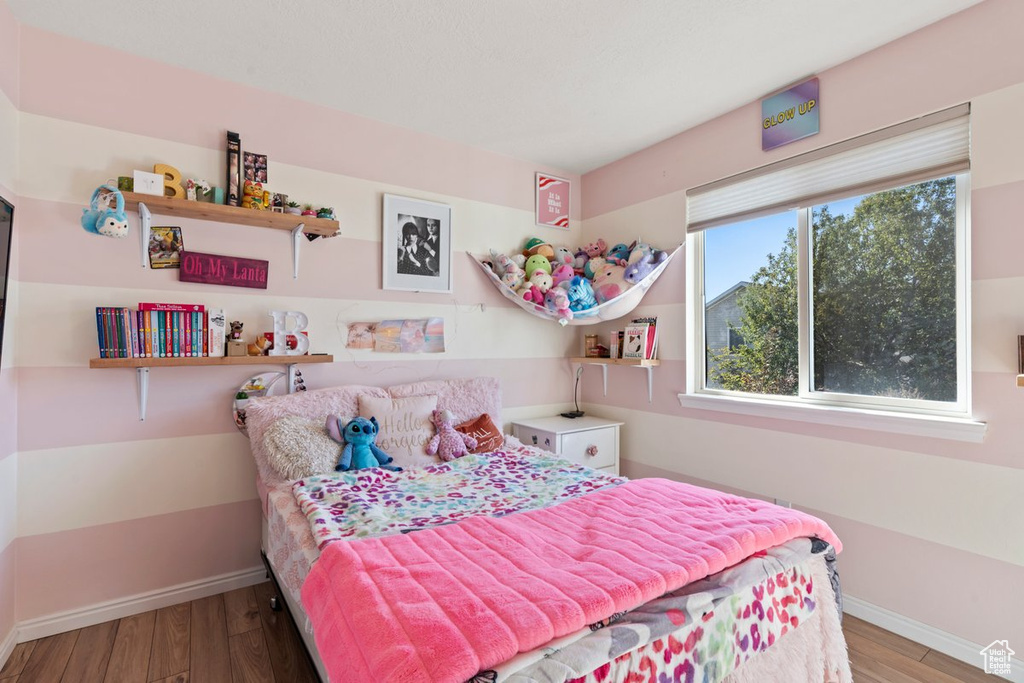 Bedroom featuring wood-type flooring