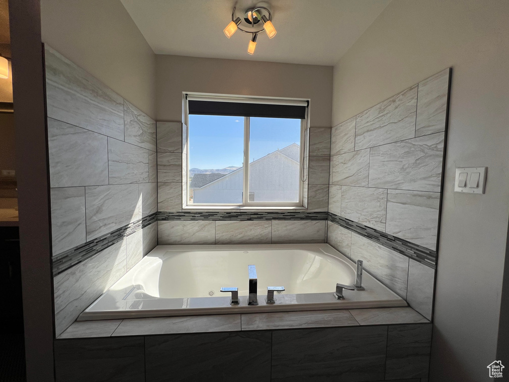 Bathroom with tiled bath