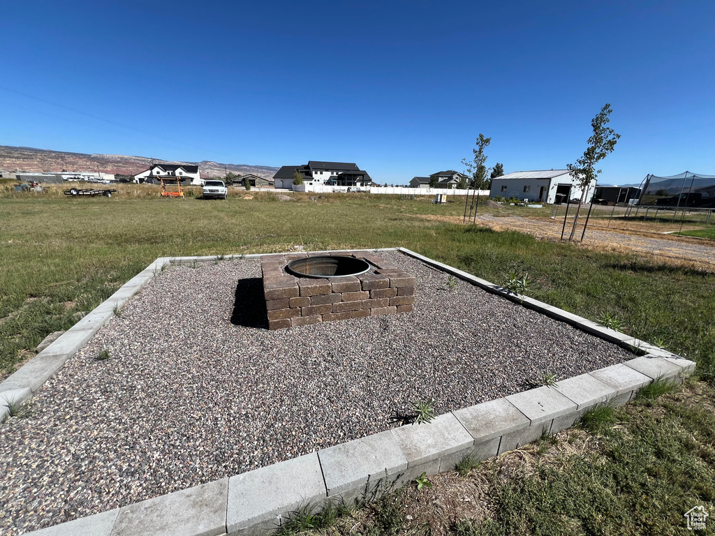 View of yard featuring an outdoor fire pit