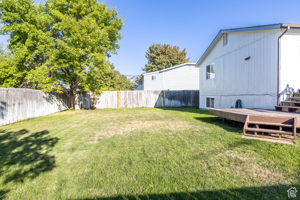 View of yard with a deck