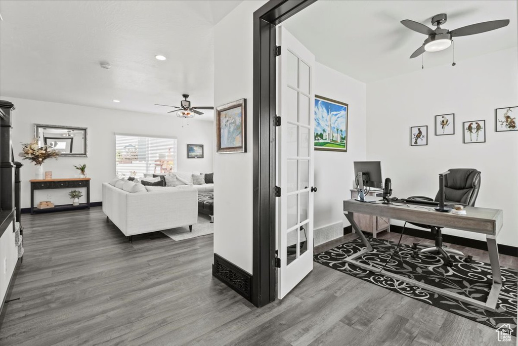 Office featuring ceiling fan and dark hardwood / wood-style floors