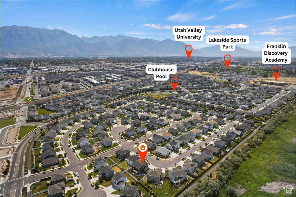 Birds eye view of property with a mountain view