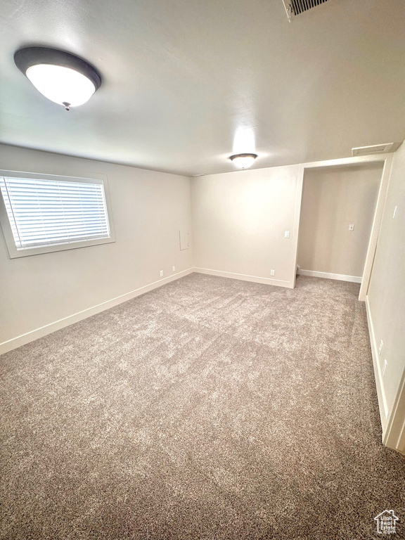 Basement with carpet flooring