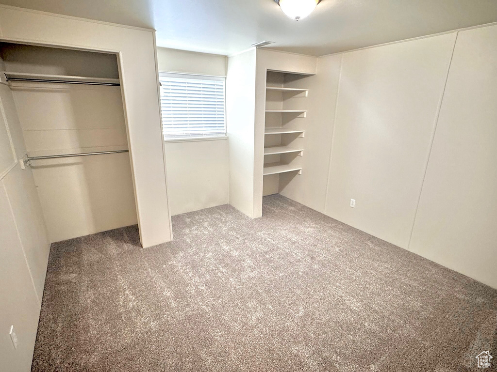 Unfurnished bedroom with carpet floors