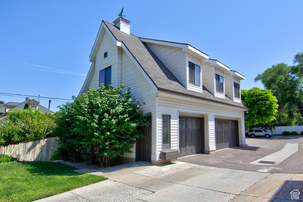 View of property exterior with a garage