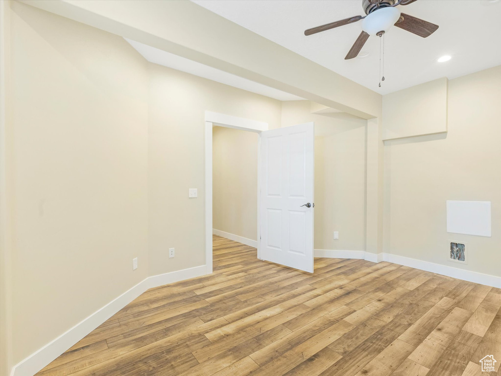 Spare room with light hardwood / wood-style floors and ceiling fan