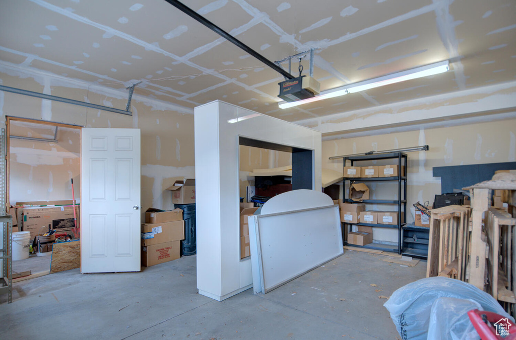 Garage featuring a garage door opener