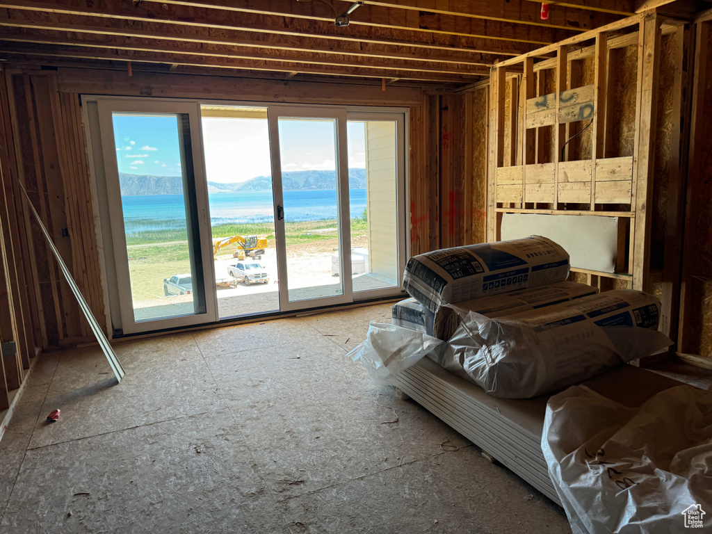 Miscellaneous room featuring a water and mountain view