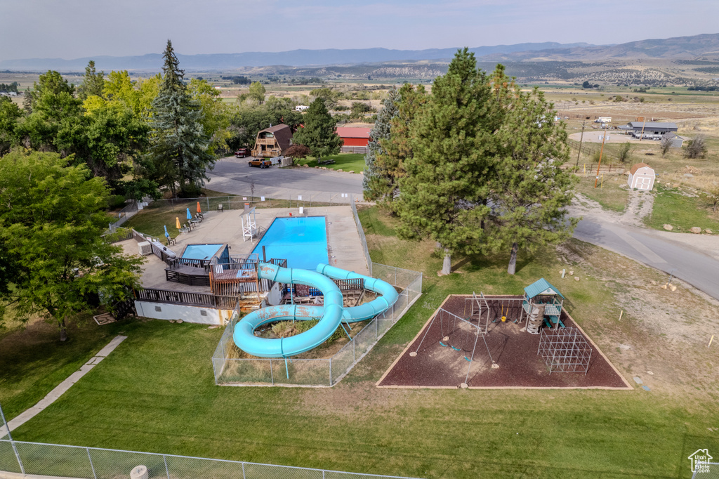 Birds eye view of property with a mountain view