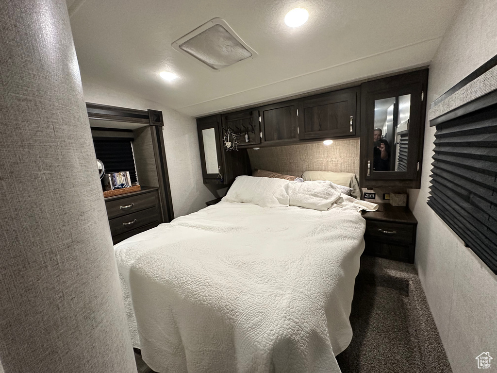 Bedroom featuring lofted ceiling
