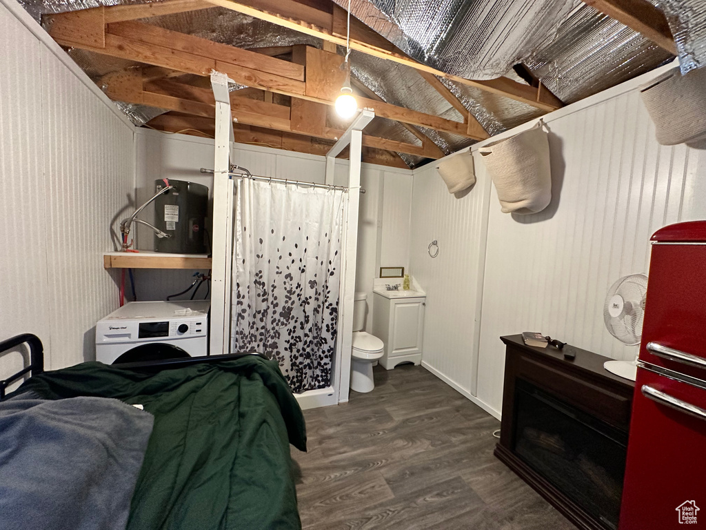 Bedroom with dark hardwood / wood-style flooring and vaulted ceiling