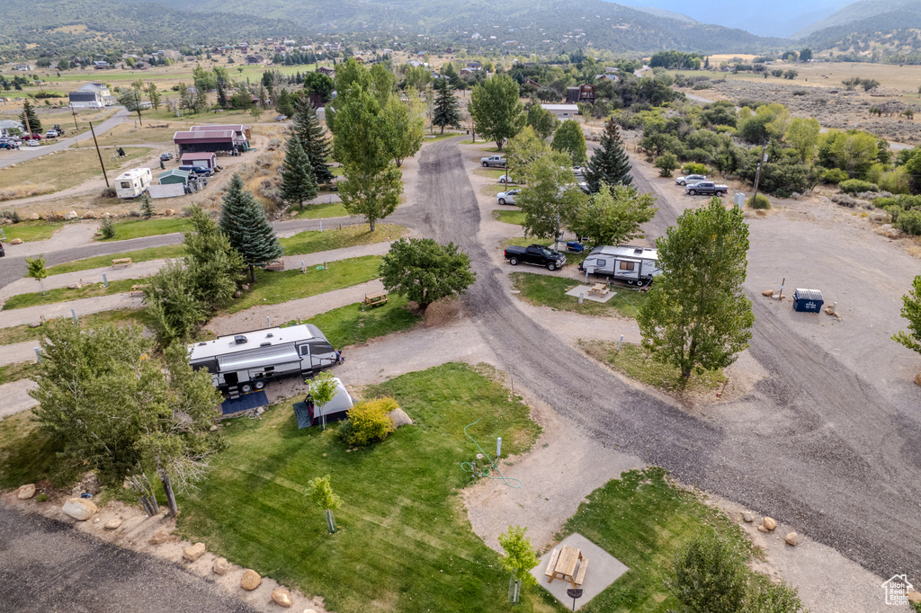 Birds eye view of property with a mountain view and a rural view