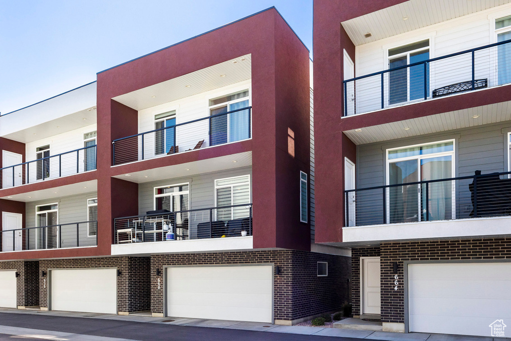 View of building exterior featuring a garage