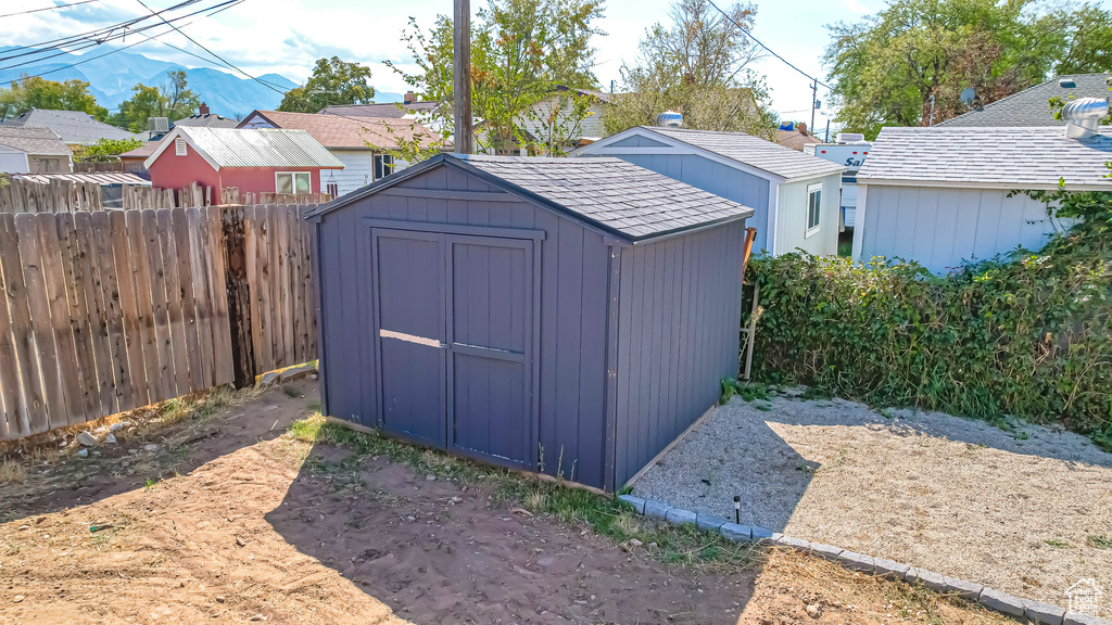 View of outbuilding with a mountain view