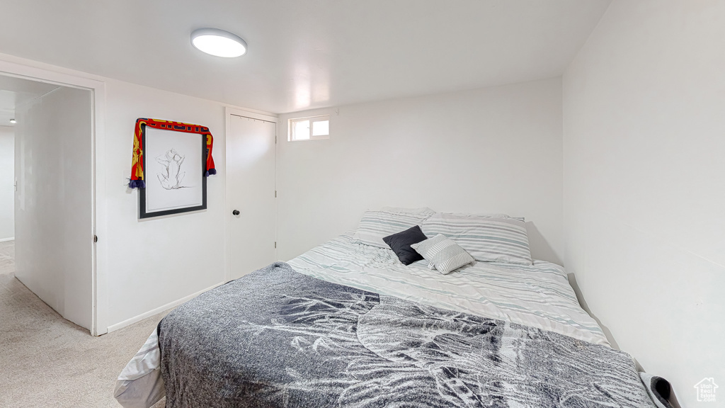 Bedroom with light colored carpet