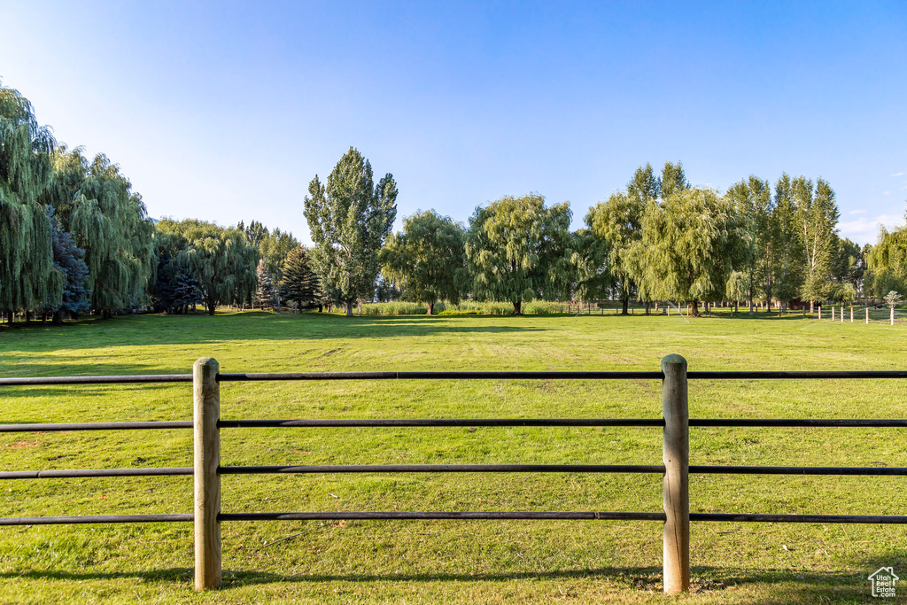 View of yard with a rural view