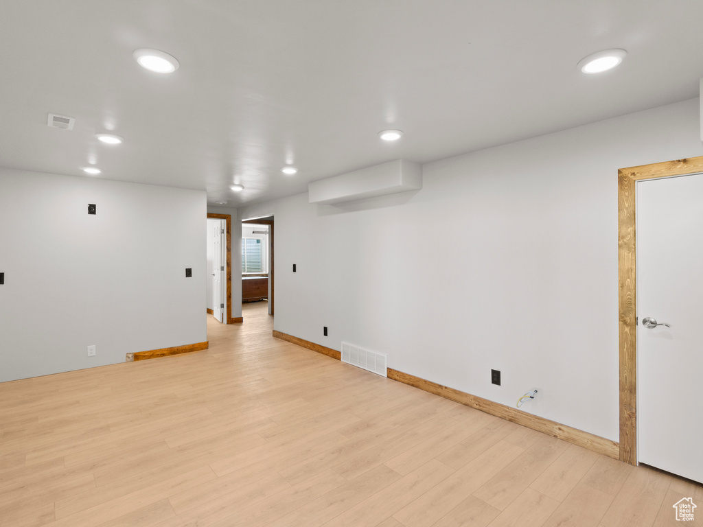 Unfurnished room featuring light wood-type flooring