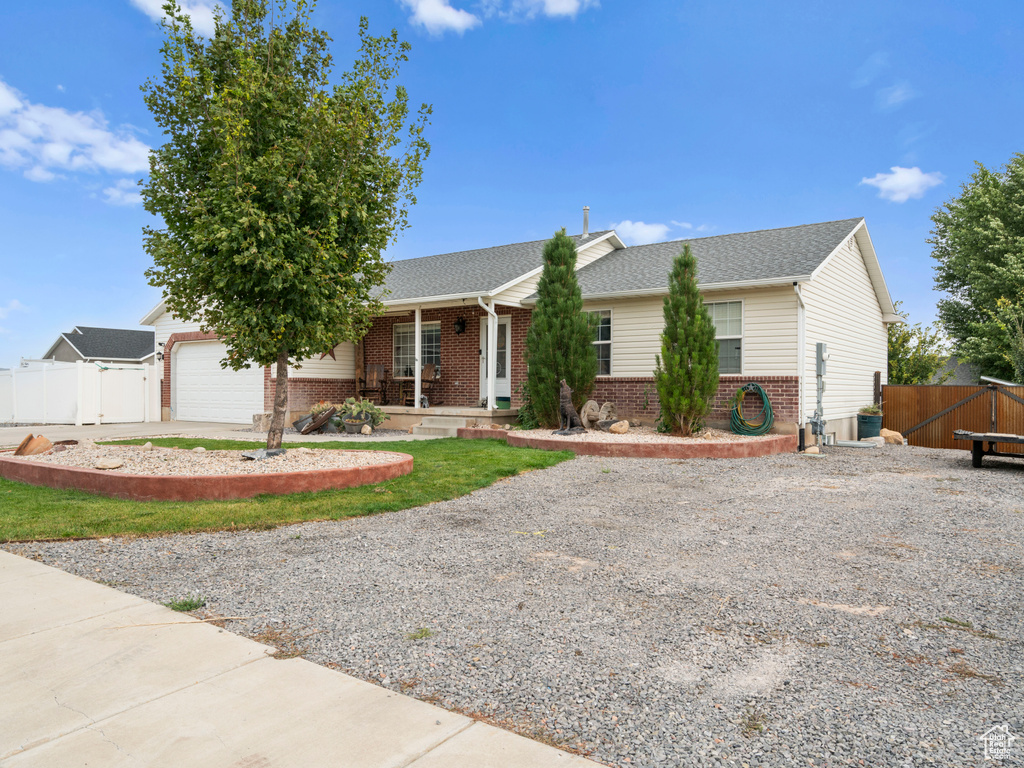 Single story home featuring a garage