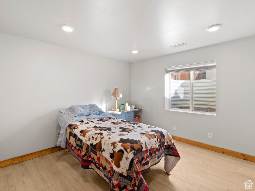 Bedroom with light wood-type flooring