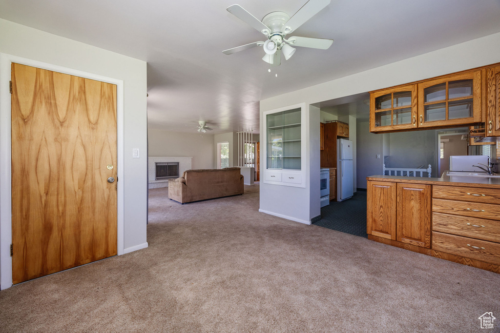 Interior space with ceiling fan and sink